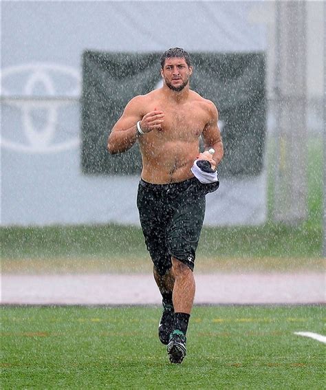Photos Tim Tebow Creates Stir By Running Shirtless In The Rain Outsports