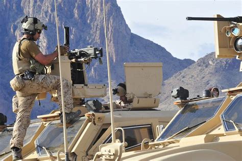 Us Navy Seals Conduct Mobility And Weapons Training In An Open Desert