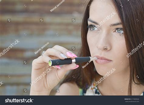 Young Woman Smoking Electronic Cigarette Ecigarette Stock Photo