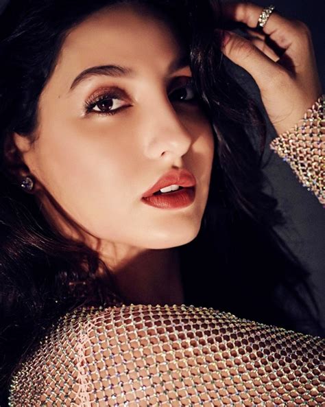 Nora Fatehi Is A Treat To Sore Eyes In Her Sheer Sparkly Nude Gown