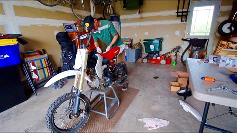 Go thru and change the spark plug, change a tire, take off the plastics and change a clutch lever. KLX110 PIT BIKE BUILD | 143cc BIG BORE KIT | PART 4 - YouTube