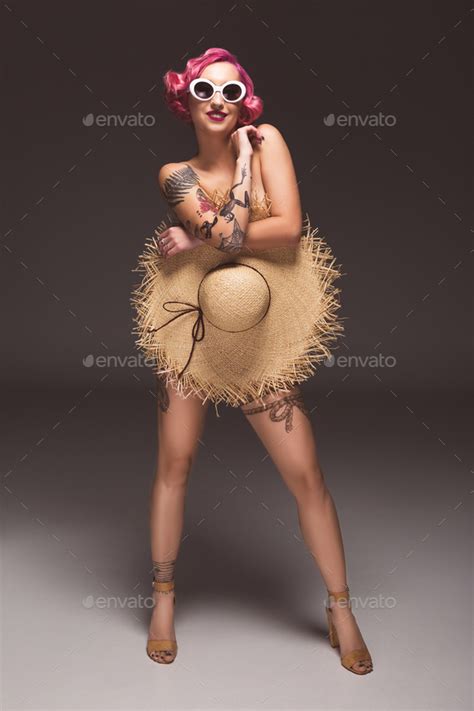 Pretty Naked Pin Up Girl In Sunglasses Covering By Straw Hat Infront Of