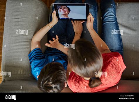 Overhead View Of Mother And Son On Sofa Using Digital Tablet Stock Photo Alamy