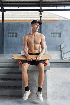 Portrait Of Man With Surfskate In Skate Park By Stocksy Contributor Yury Goryanoy