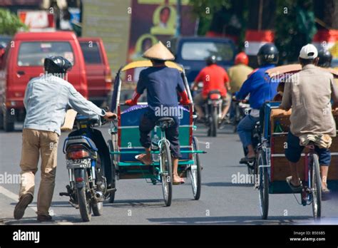 Riding In A Becak Or Bicycle Rickshaw In Makassar On Sulawesi In