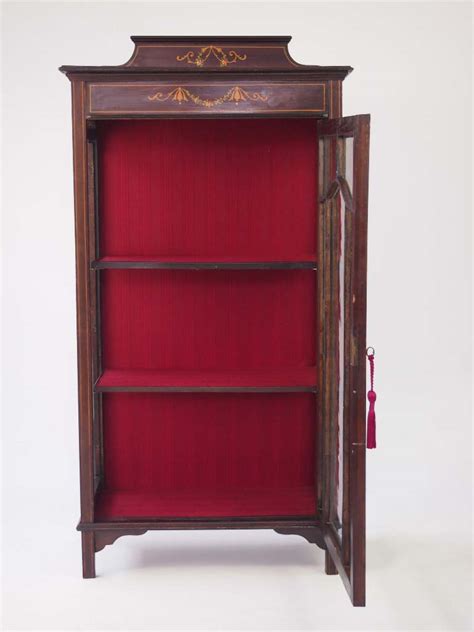 Cleverly designed for handling and installation this comes in multiple segments. Small Edwardian Mahogany Cabinet Bookcase For sale