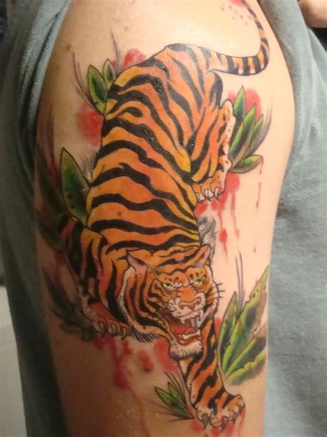 Get your country flag inked on your shoulder and you will be more than proud to show it. Tiger Tattoos - Page 5