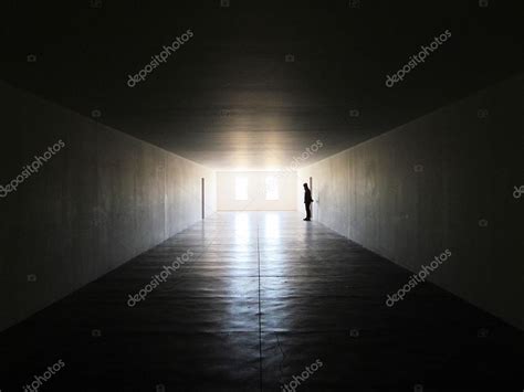 A Man Standing In Dark Room — Stock Photo © Dgworld 23460888