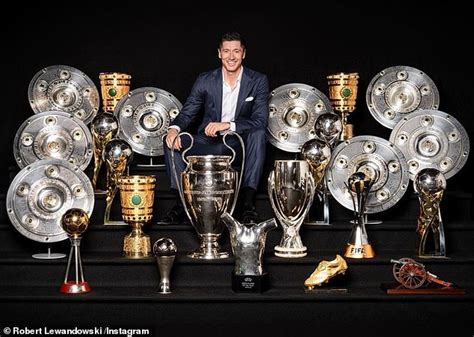 Robert Lewandowski Poses With The Twenty Four Trophies He Won At Bayern Munich Daily Mail Online