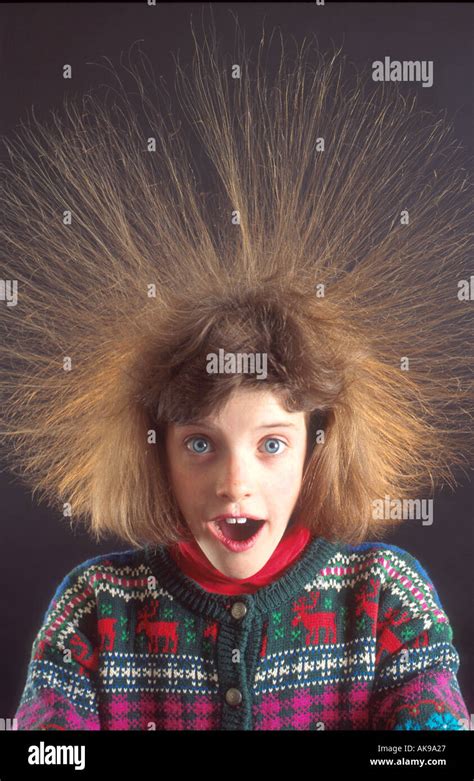 Girl With Hair Standing On End Do To Static Electricity Stock Photo Alamy