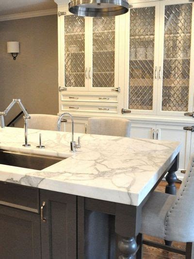 First, i am very torn between a polished or honed finish. grey quartzite countertops | Kitchen Lab Mother of Pearl ...