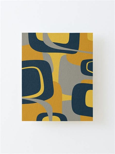 A Yellow And Blue Abstract Pattern On A White Background Canvas Print