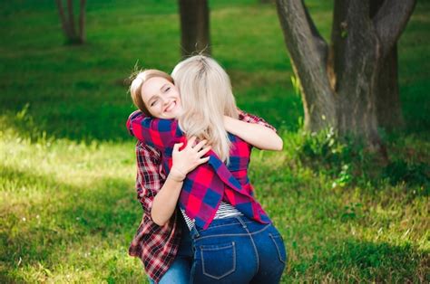 Premium Photo Girl Hugging Her Best Friend In The Park
