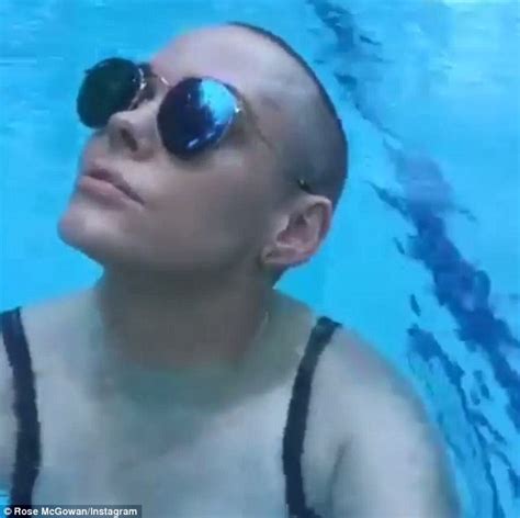 Rose Mcgowan Flashes Major Cleavage In Slashed Bathing Suit As She