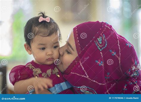 Young Asian Muslim Mother And Her Daughter Child Girl Stock Photo