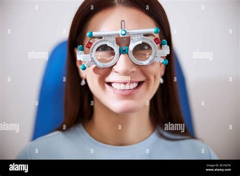 Woman Joyfully Smiling While Wearing The Trial Frame Stock Photo Alamy