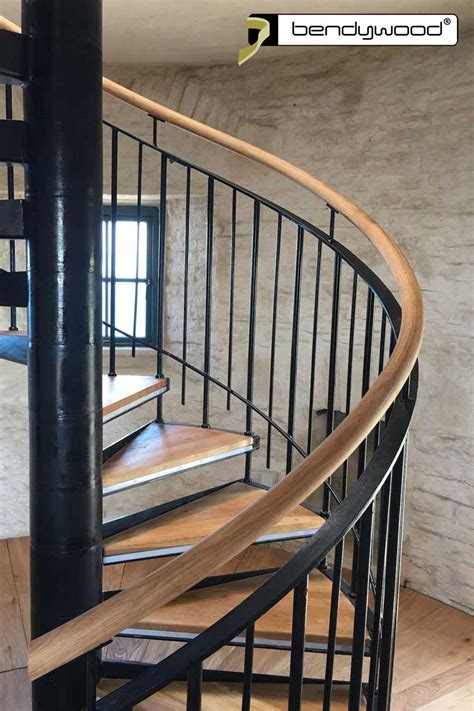 Spiral Staircase With Solid Wooden Handrail In Bendywood Oak Wood