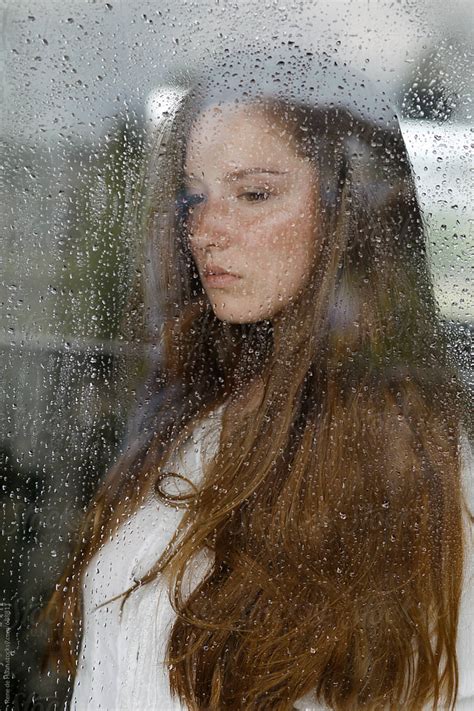 Young Woman Behind Window With Raindrops By Rene De Haan Depressed