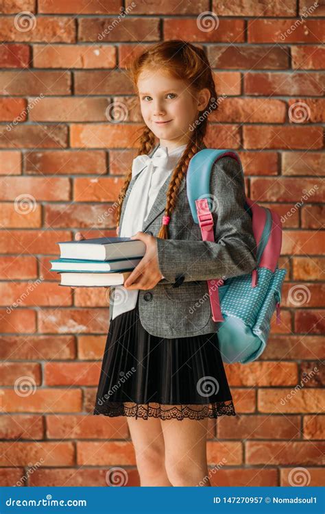 Cute Schoolgirl With Schoolbag Holds Textbooks Stock Image Image Of Pupil People 147270957