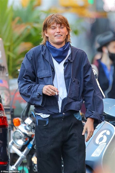 Supermodel Jordan Barrett Wears Edgy Baggy Outfit And Slides As He Puffs Away On A Cigarette