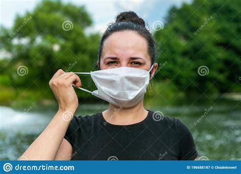 woman is taking off protective mask from her face stock image image of disease medical 196688187