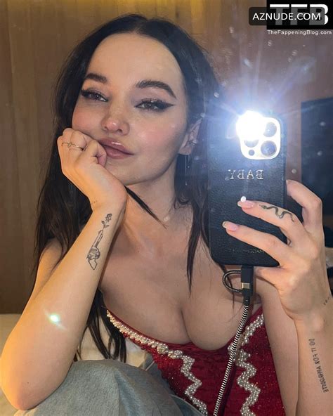 Dove Cameron Sexy Poses Showing Off Her Hot Cleavage In A Red Corset On