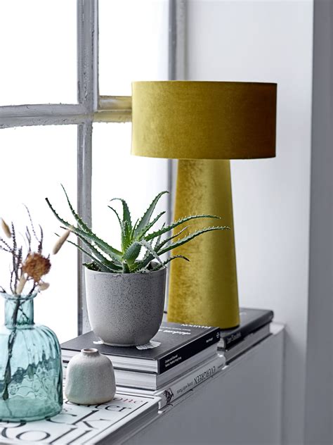 For a more nostalgic touch, why not go for a stained glass lamp? Bloomingville Table lamp - Yellow | Made In Design UK