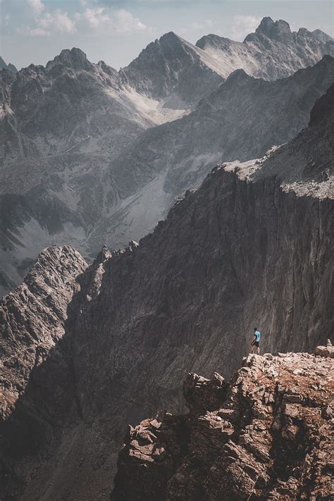 Mountains Rocks Man Loneliness Nature Hd Phone Wallpaper Peakpx