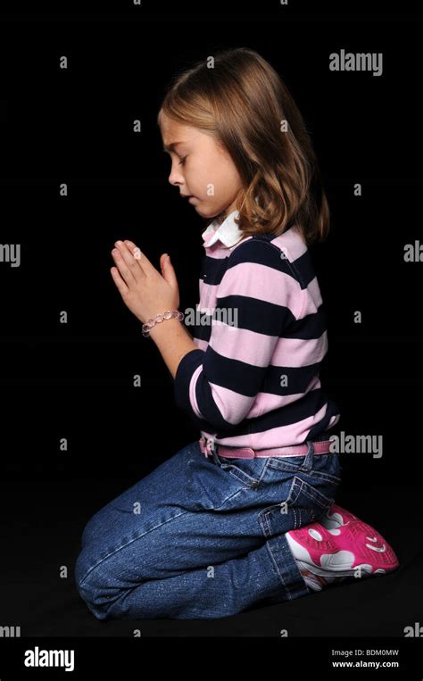 Portrait Of Young Girl Praying With Hands Together Stock Photo Alamy