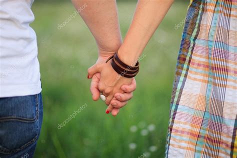 Couple Holding Hands — Stock Photo © Nikuwka 12419897