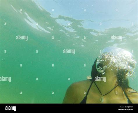 Close Up Of Woman Swimming Underwater Stock Photo Alamy