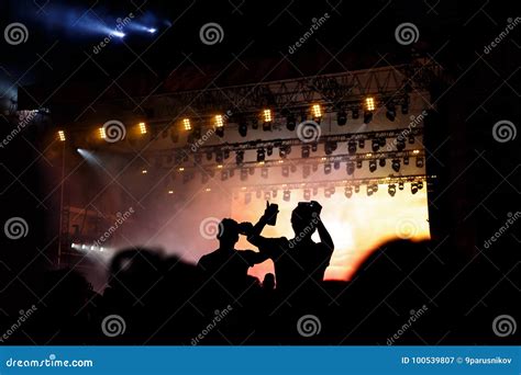 Rock Concert Silhouettes Of Happy People Raising Up Hands Stock Image