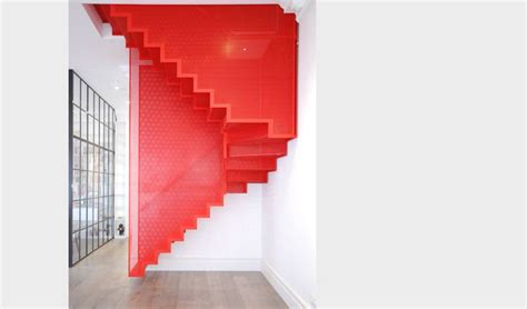 A Red Stair Case In The Corner Of A Room