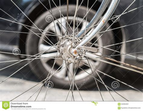 Bicycle Versus Car Wheels Against Each Other Stock Image Image Of