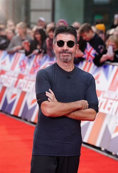 breaking simon cowell is set on fire by masked contestant during bgt auditions whattolaugh