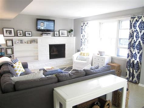 They can dress windows either alone or in conjunction with blinds and other types of window treatments. Navy/White curtains on grey wall | living room | Pinterest