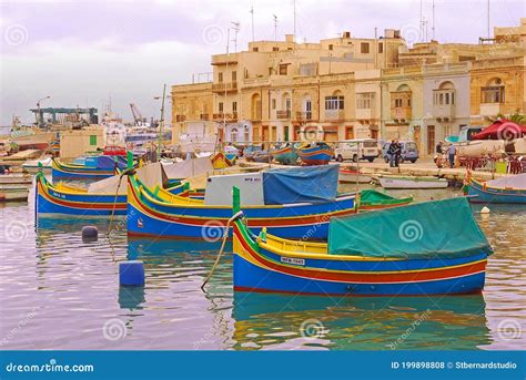 A Number Of Colourful Traditional Maltese Fishing Boat Luzzu Docking