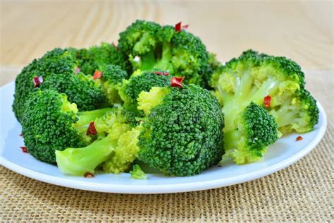 Steamed Broccoli With Red Pepper Flakes On Plate Stock Photo Image Of