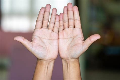 Both hands open in front or you, palms facing you, move up and down in opposite directions, with fingers of right hand overlapping fingers of left hand. 21 Hand Symptoms That Indicate Bigger Health Problems
