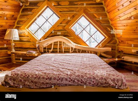 Handmade Bed In Funky Log Cabin Stock Photo Alamy