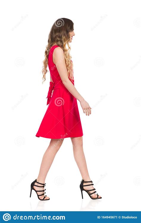 Walking Woman In Red Dress And High Heels Side View Stock Image