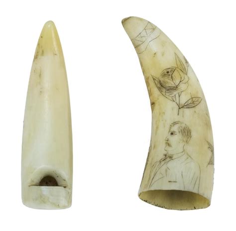 lot two small scrimshaw whale s teeth one a whistle decorated with a pinpoint full length