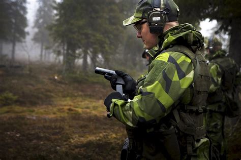 Swedish Soldier Reloading His Glock In The Eerie Scandinavian Forest