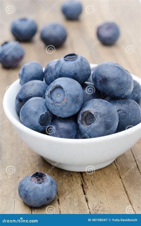White Bowl Of Fresh Blueberries On A Wooden Background Stock Image