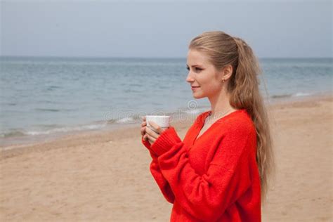 Beautiful Blonde Woman Drinks Hot Drink On Sea Beach Stock Image Image Of Blue Drink 182360597