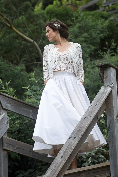 a chic bridal separate with a crochet lace top and bolero and a full plain skirt dress midi