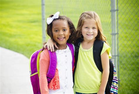 Two Little Kids Going To School Together Stock Photo Image Of Girls