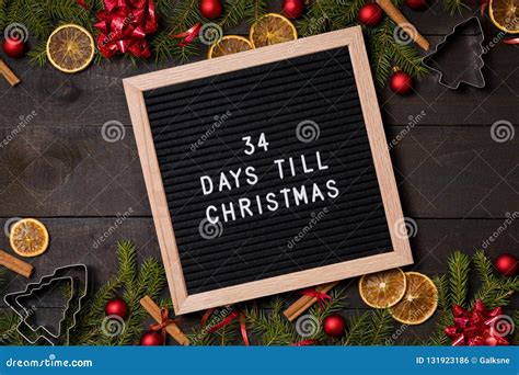 34 Days Till Christmas Countdown Letter Board On Dark Rustic Wood Stock
