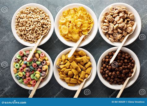 Variety Of Cold Cereals In White Bowls With Spoons Stock Image Image