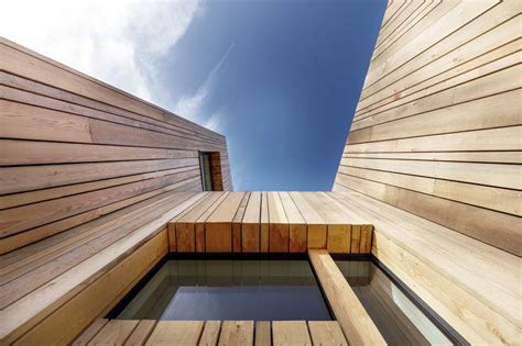 Vertical Wood Siding Covers This Contemporary Holiday